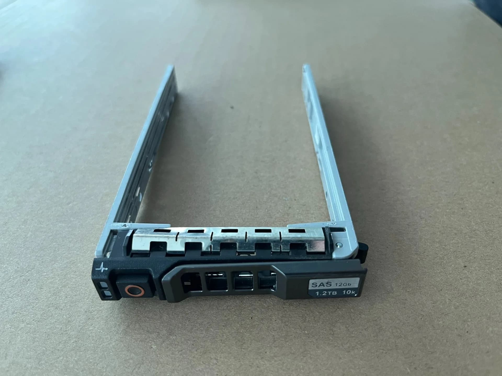Dell 2.5-inch drive caddy shown with its carrier rails