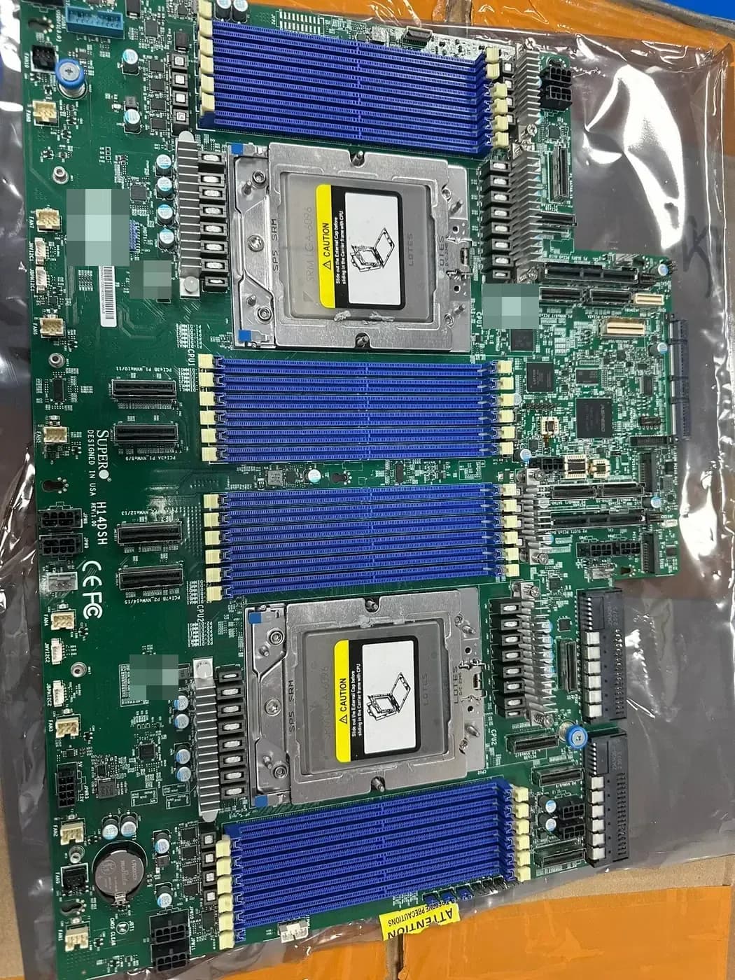 Server motherboard with processor sockets, memory slots, and a board model marking
