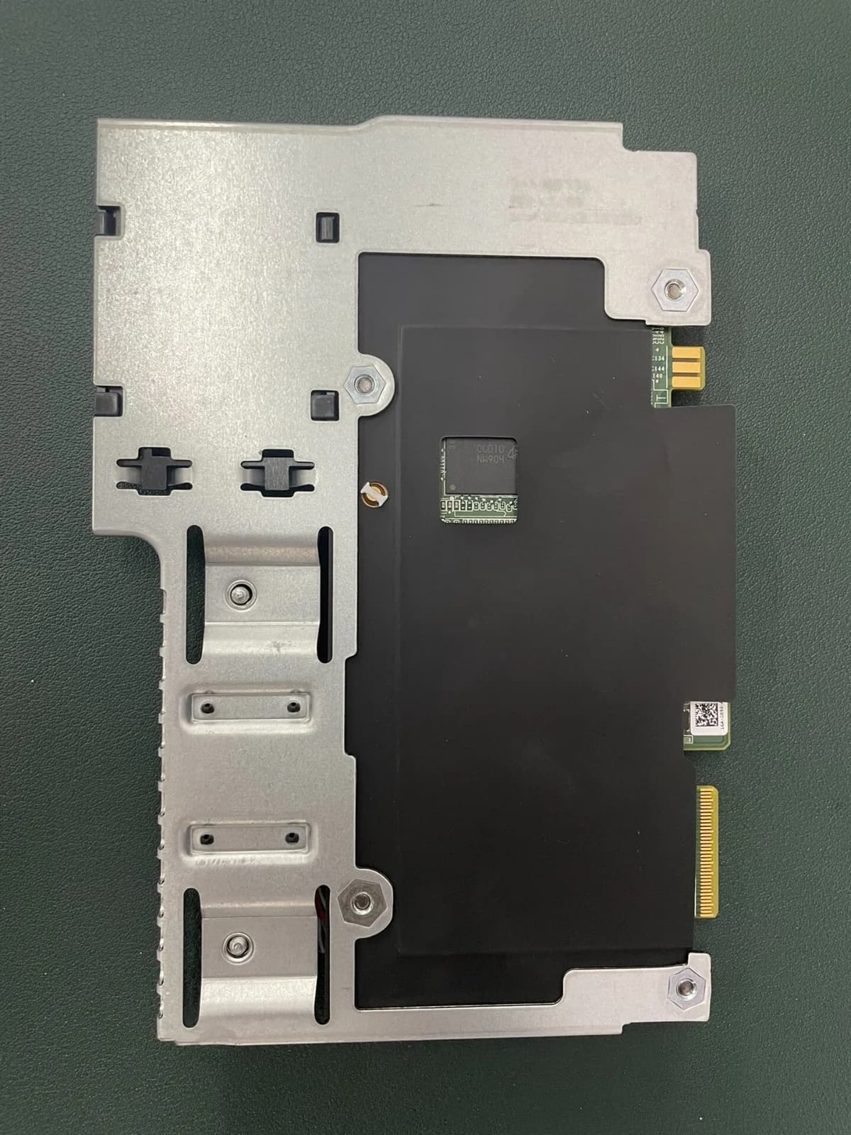 Rear view of a Dell storage controller module and its mounting carrier